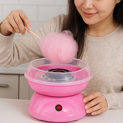 maman fait barbe a papa dans la cuisine avec machine barbe a papa rose